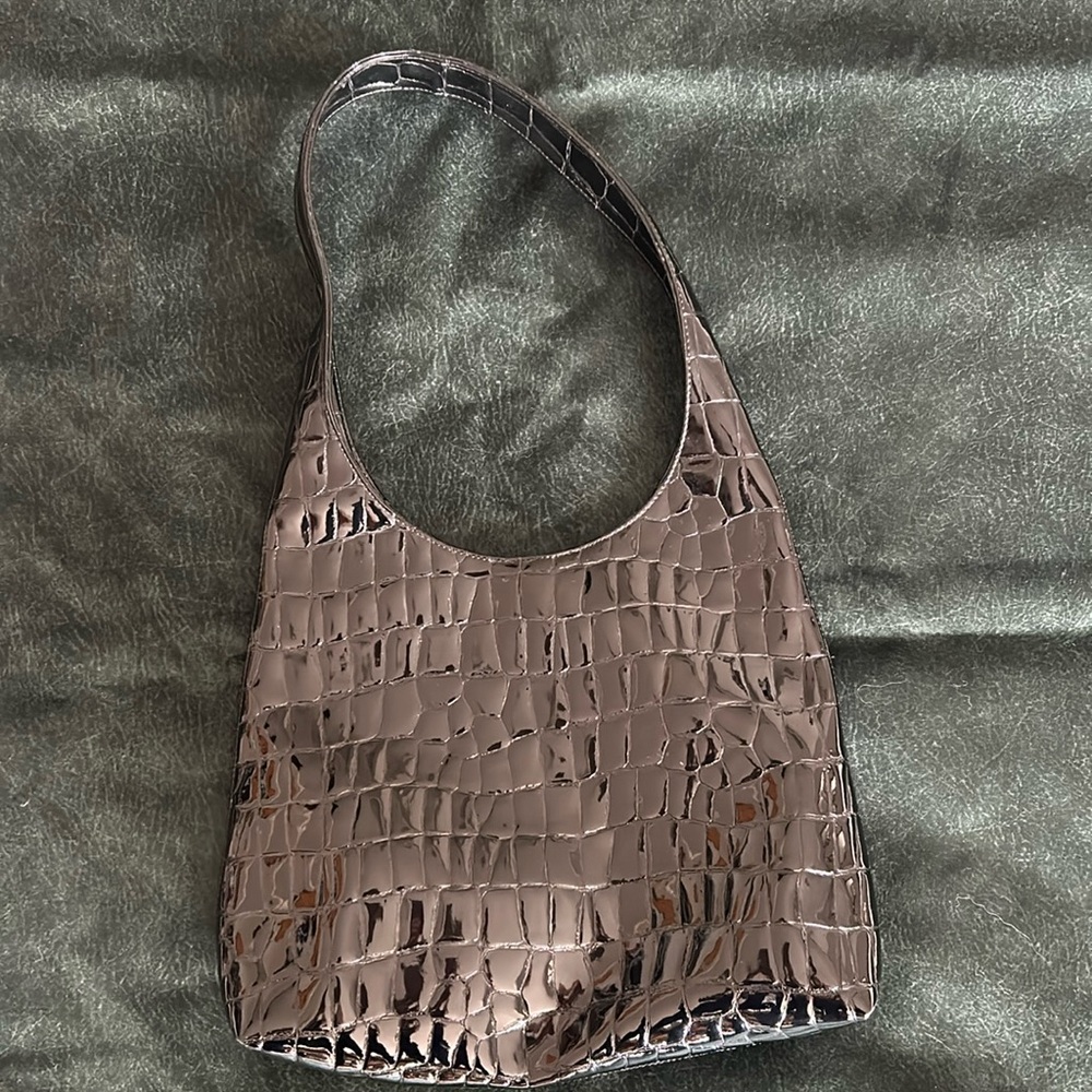 Used DKNY City bag.  Black patent leather snake skin pattern.